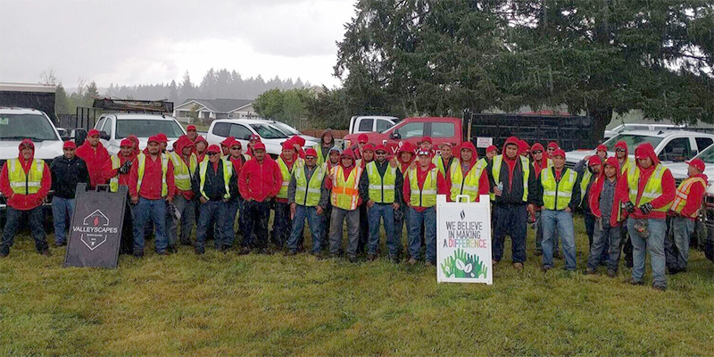 Valley Scapes landscaping crew group photo outside in the rain